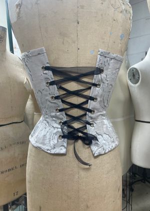 Silver hourglass corset with laced up back