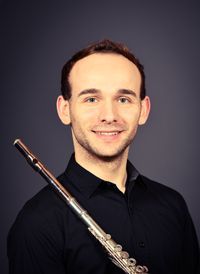 Headshot of Dustin White with his flute