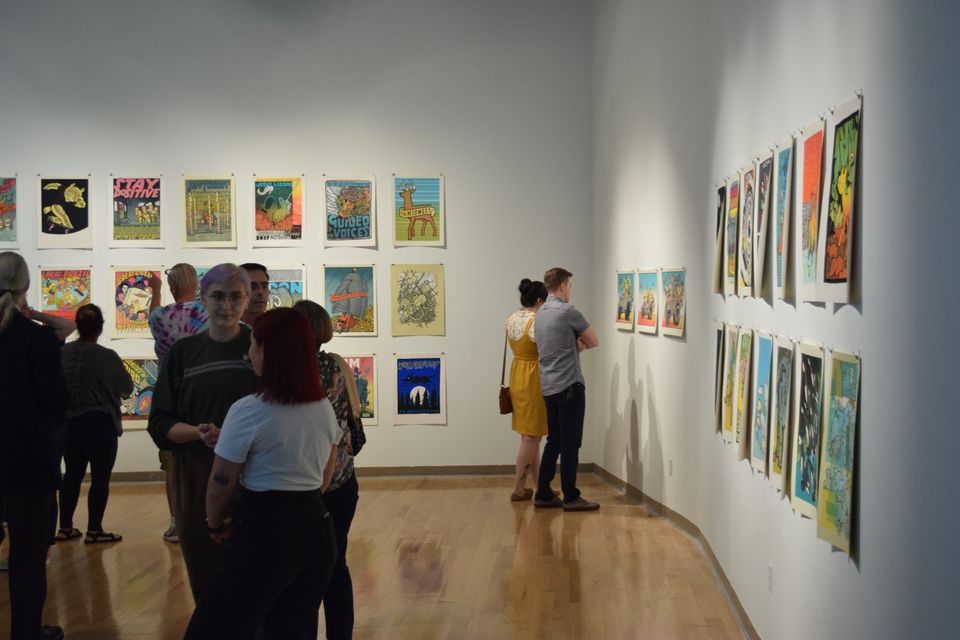 students explore the Jay Ryan exhibition in the Mesaros Galleries